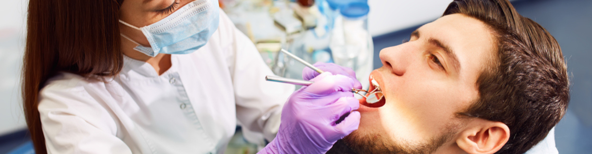 A dentist working with a patient.
